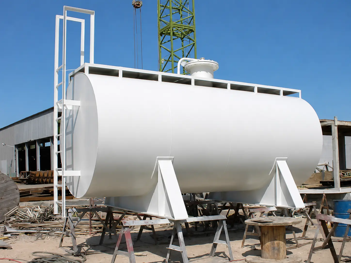 Horizontal storage tank fabricated with access ladder and support saddles