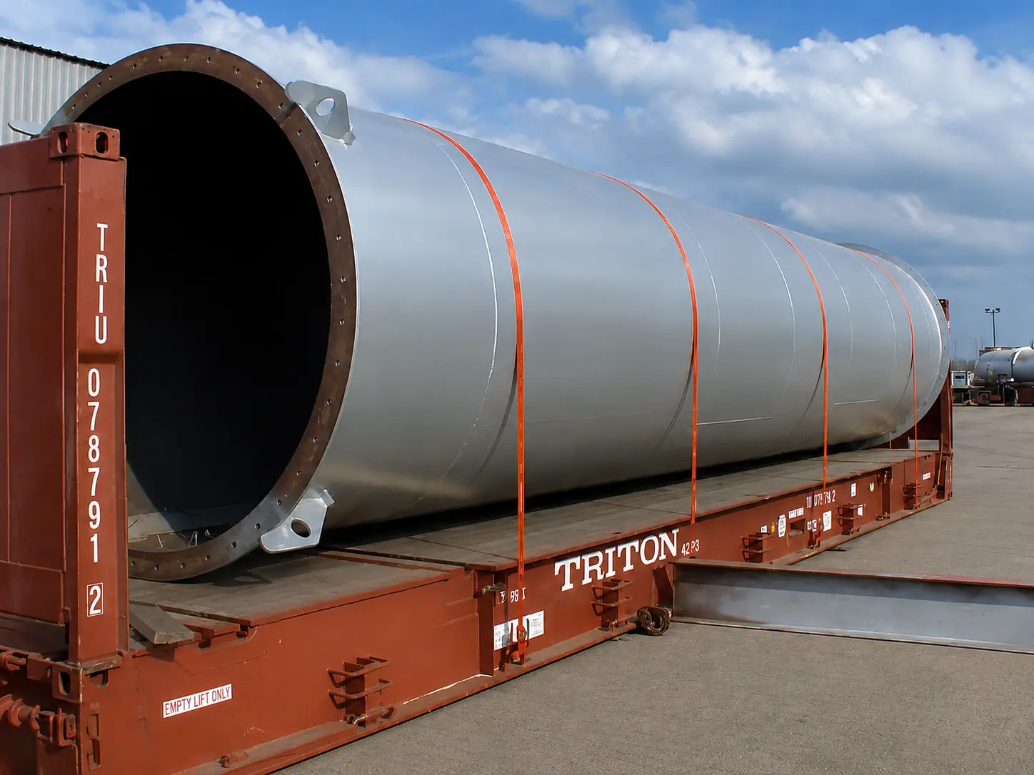 Rolled steel monopile loaded for transport